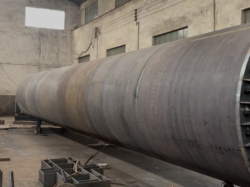 The long steel drum body under fabrication.